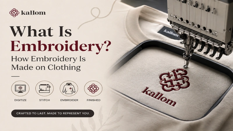 What is embroidery close-up of hand embroidery being stitched onto fabric with needle and thread